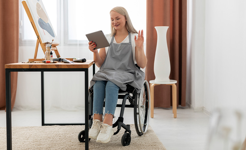 disabled woman in a wheelchair painting