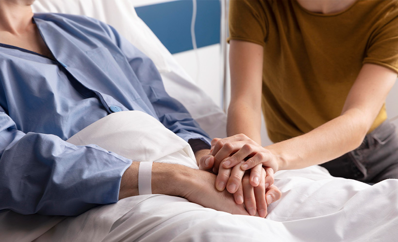 woman visiting ill husband